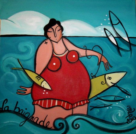 femme dans l'eau de mer + poissons